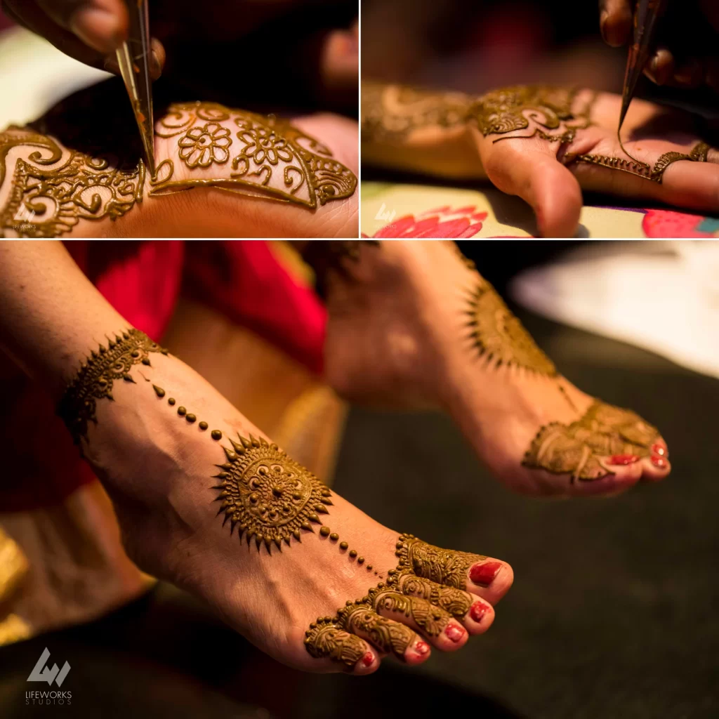 Close-up of a bride's hands and foot adorned with intricate and elaborate Mehendi designs, featuring traditional patterns and motifs that complement her bridal attire.