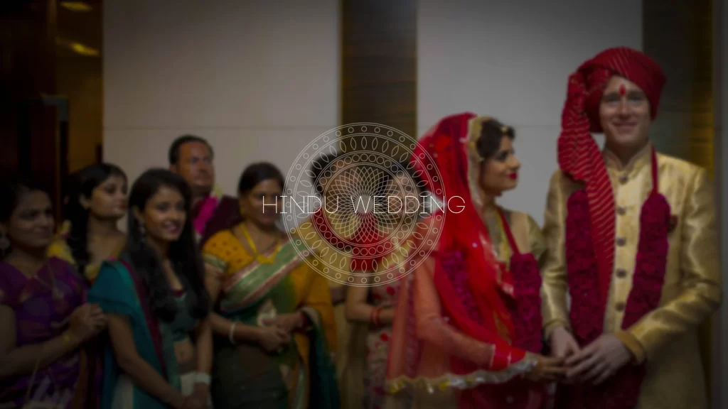 A digital illustration depicting a bride, groom, and the phrase 'Hindu Wedding' integrated into the design, showcasing traditional wedding attire and elements symbolic of Hindu matrimonial customs.