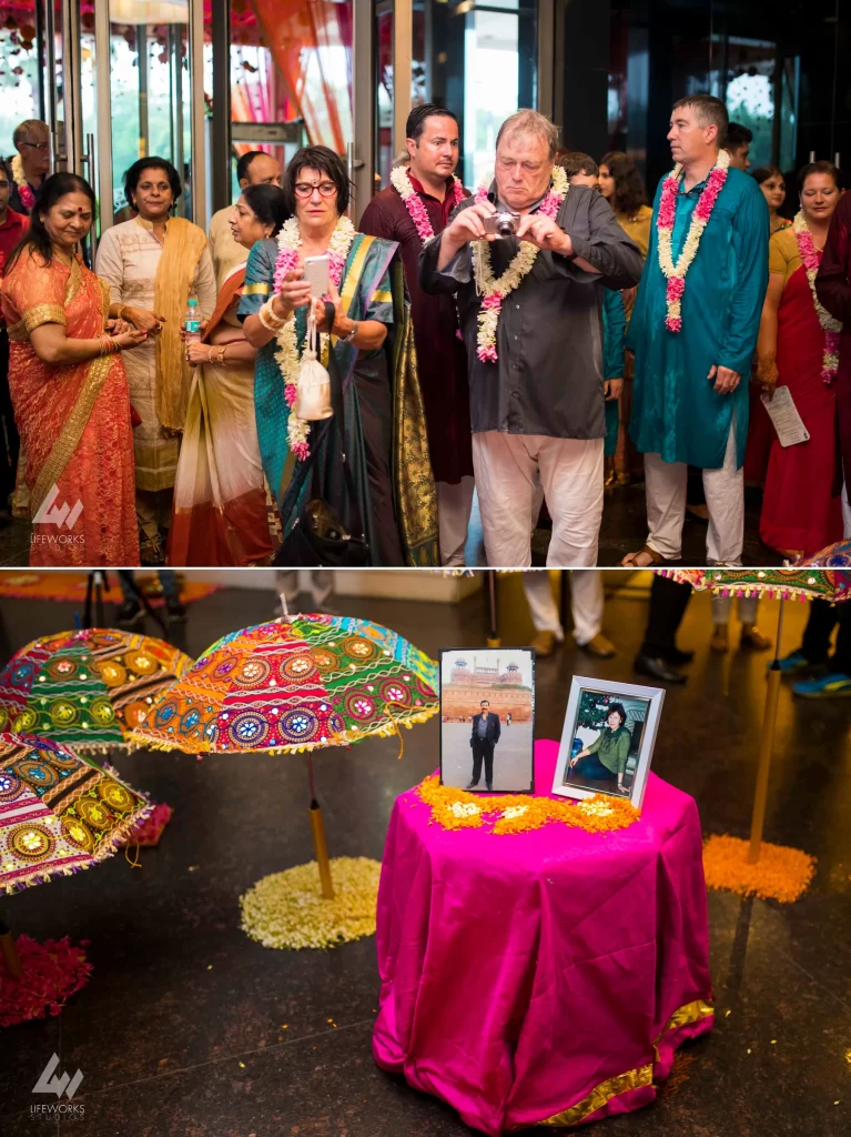 An image capturing the guests at a wedding function, adorned in elegant attire and engaged in celebratory activities, contributing to the joyous atmosphere of the event.