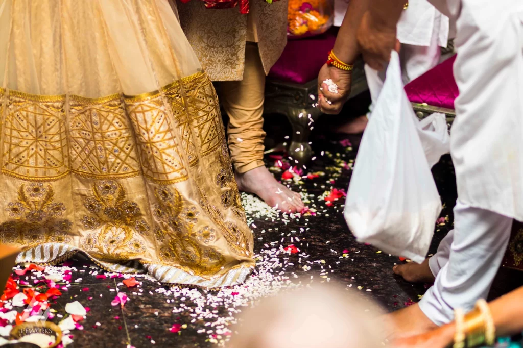 An image capturing the bride and groom participating in traditional wedding ceremonies, surrounded by sacred rituals, symbolizing the sacred union and commitment in the auspicious celebration.