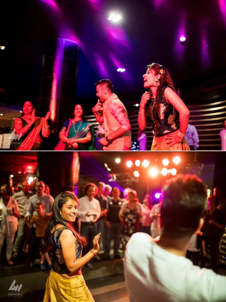 Guests joyfully dancing at a Mehendi celebration, showcasing vibrant traditional attire and lively movements as they participate in the festive event.