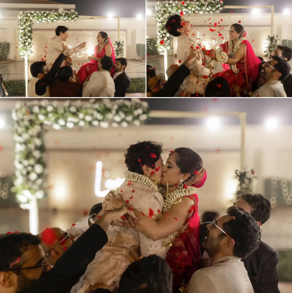 Both brides exchanging warmala, traditional wedding garlands, as a symbol of love and mutual acceptance during their same-sex marriage ceremony.