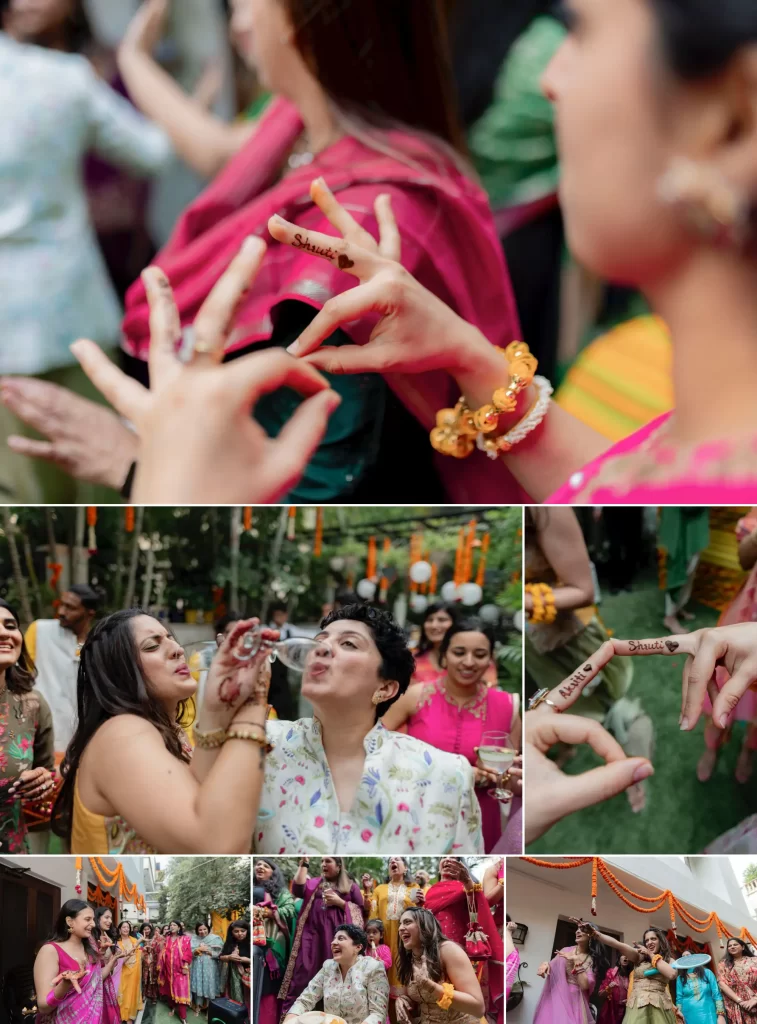 Guests proudly displaying their intricate mehendi while both brides, radiating joy and laughter, join in the celebration and revelry.