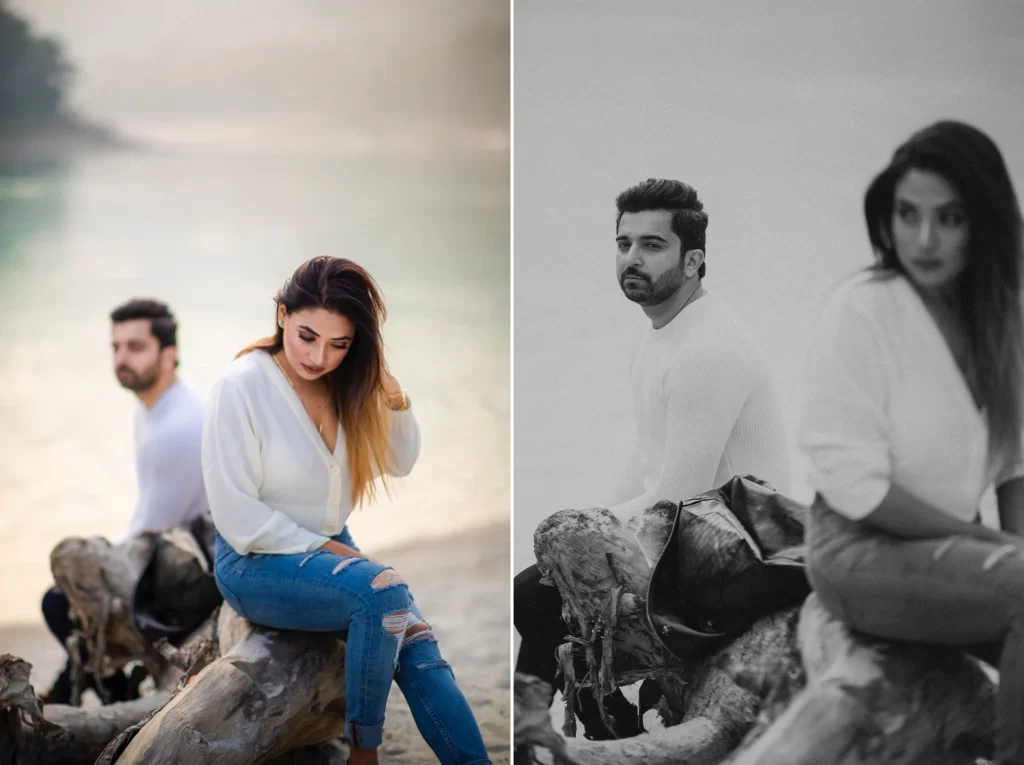 A serene image portrays a couple seated on a rock near a river, surrounded by breathtaking natural scenery. The couple's relaxed posture and peaceful surroundings evoke a sense of tranquility and togetherness, creating a timeless moment in the pre-wedding shoot.