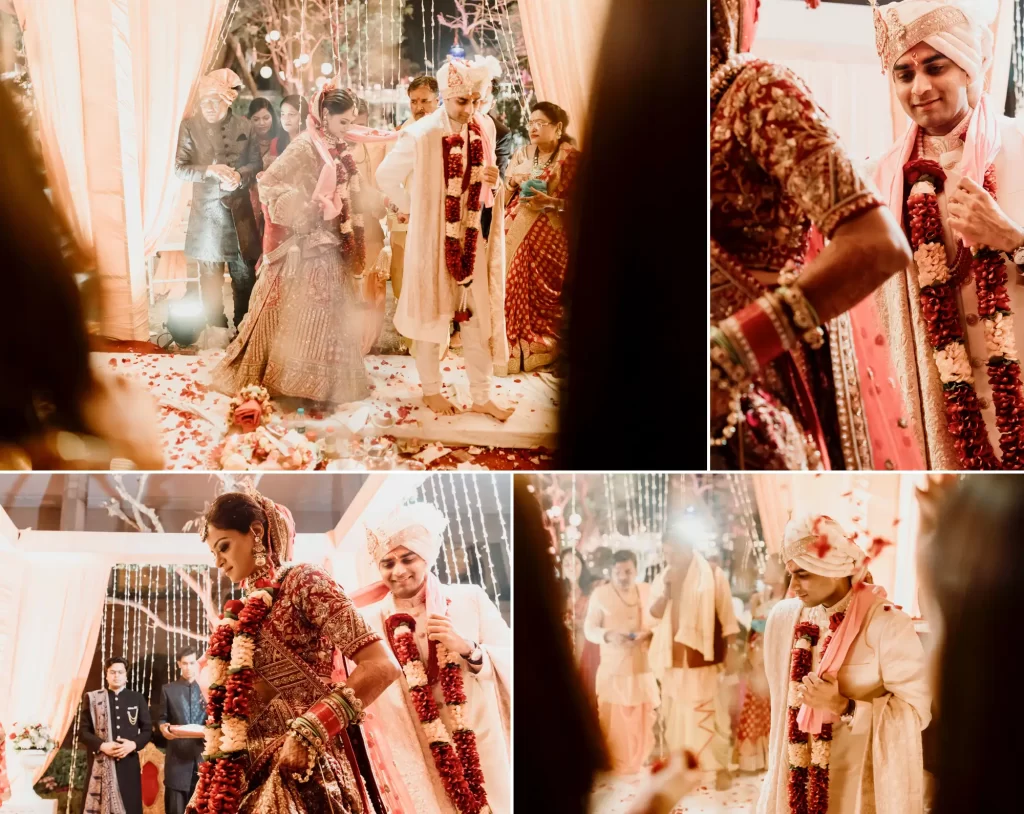 A couple taking part in the sacred ritual of 'fera' at the mandap, encircling the sacred fire as part of traditional Hindu wedding ceremony, amidst the blessings of family and religious officiants.