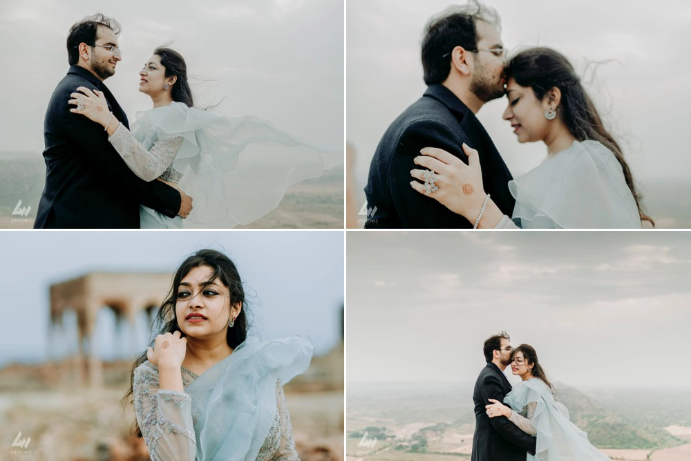 A heartfelt moment captured during a pre-wedding shoot, as the young man lovingly kisses his partner's forehead against the picturesque backdrop of the fort's timeless beauty.