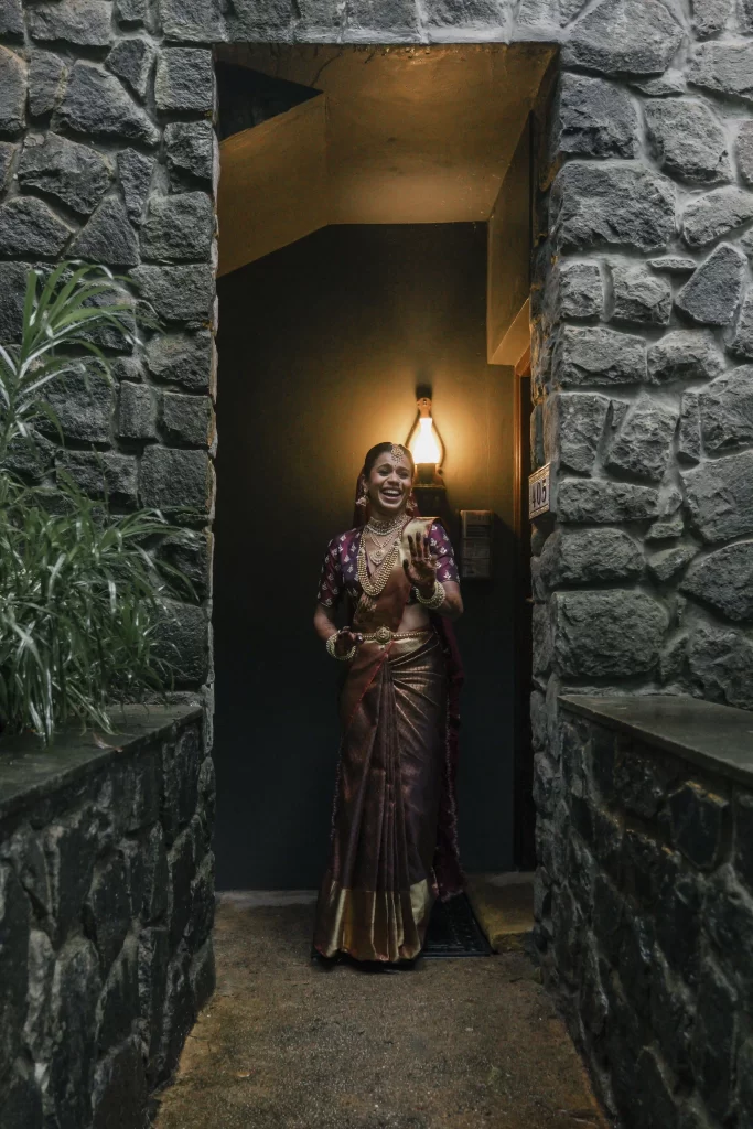 A radiant bride adorned in an exquisite Indian saree, displaying timeless elegance and cultural richness on her wedding day.