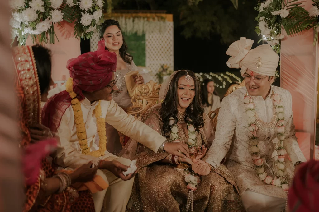 Pristine decor surrounds the bride and groom as they participate in sacred rituals during their destination wedding at Jaypee Palace, Agra.