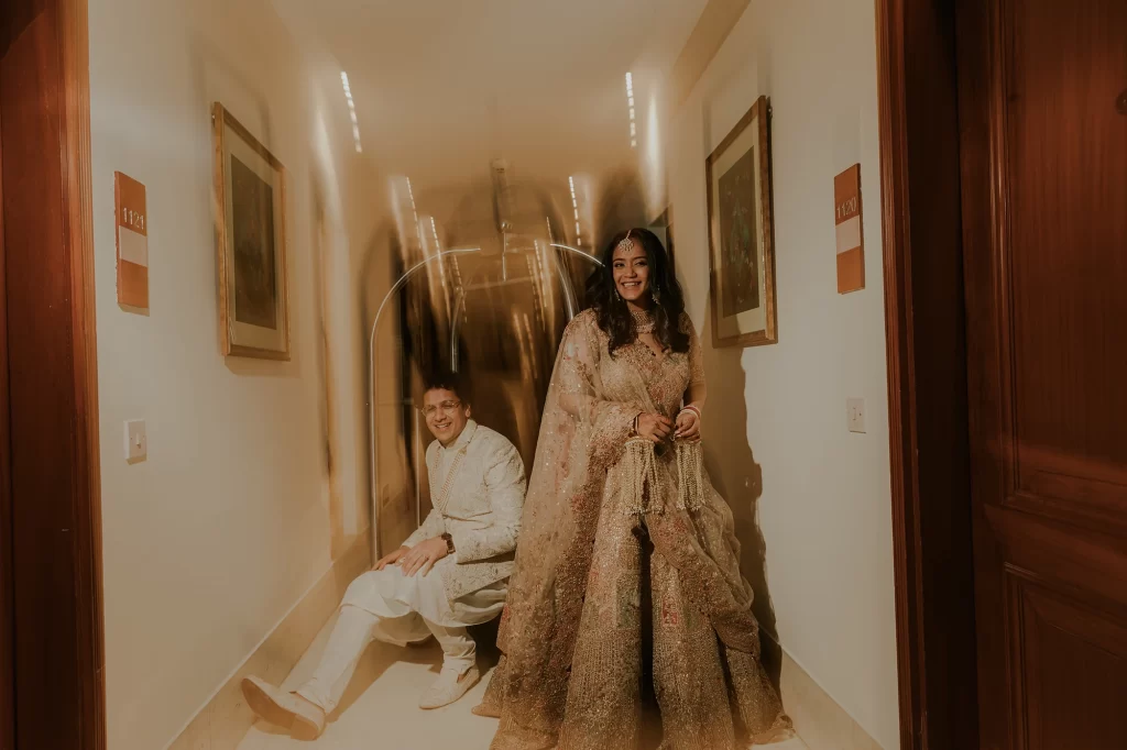 Glowing bride and dashing groom engage in traditional ceremonies at their opulent destination wedding at Jaypee Palace in Agra, India.