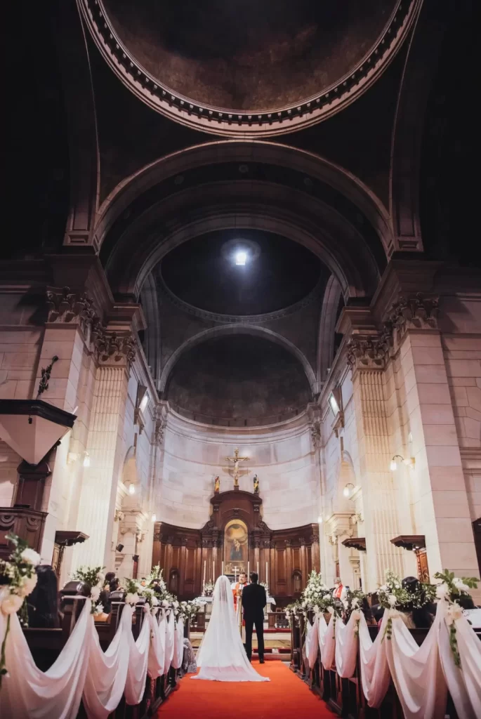 A majestic church serving as the picturesque setting for a beautiful wedding ceremony