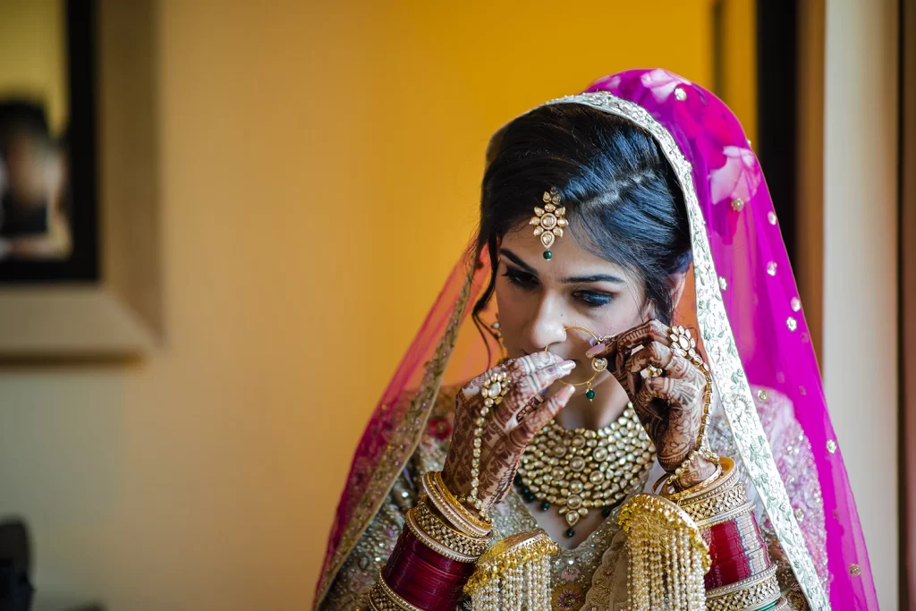 Captivating image of an Indian bride capturing the essence of her destination wedding at The Grand Delhi in a stylish photo shoot.