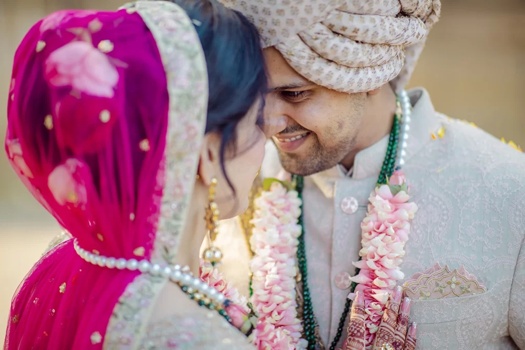 Captivating image of the bride and groom in a post-wedding photoshoot, showcasing their romance and happiness in a serene setting.