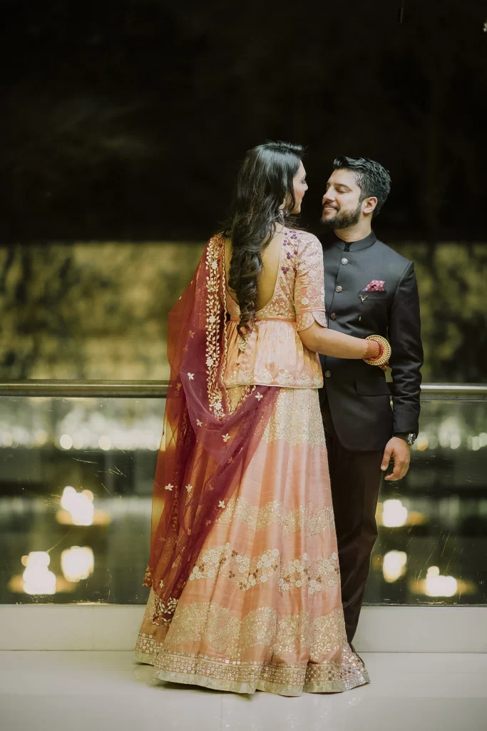 Romantic couple gazing into each other's eyes, embracing at The Oberoi, Delhi, capturing a heartfelt moment of connection.