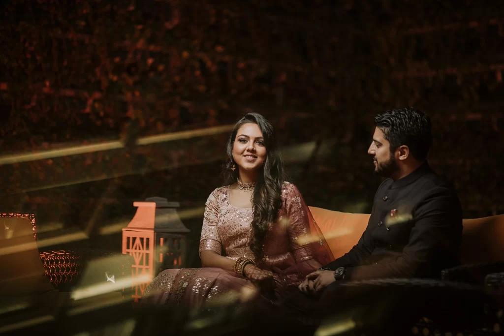 A couple shares intimate and candid moments during a photo session at The Oberoi, Delhi, filled with warmth and tenderness.