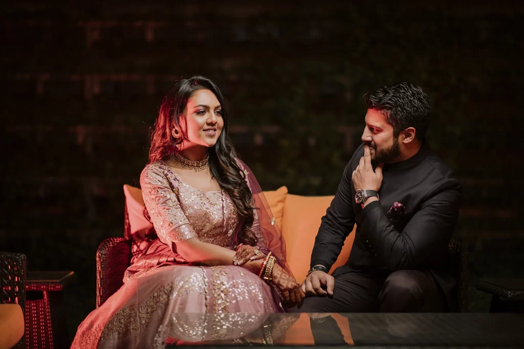 Couple enjoying a candid photo session at The Oberoi, Delhi, standing close and sharing tender moments