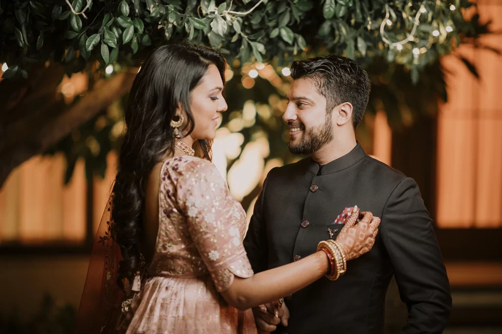 A couple shares intimate and candid moments during a photo session at The Oberoi, Delhi, filled with warmth and tenderness.