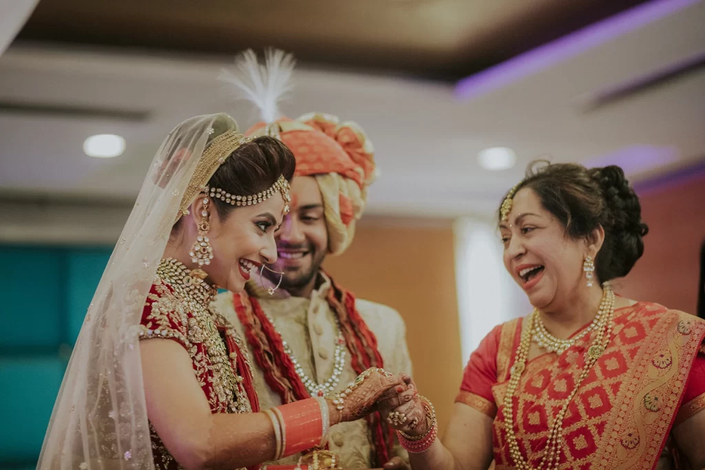 The joyful bride conversing with her mother, sharing moments of happiness and love before the start of her new life.