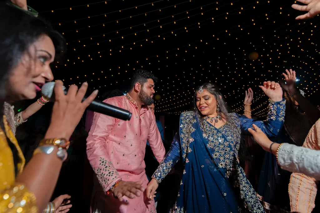 Gujarati bride and groom performing traditional Garba dance at their wedding