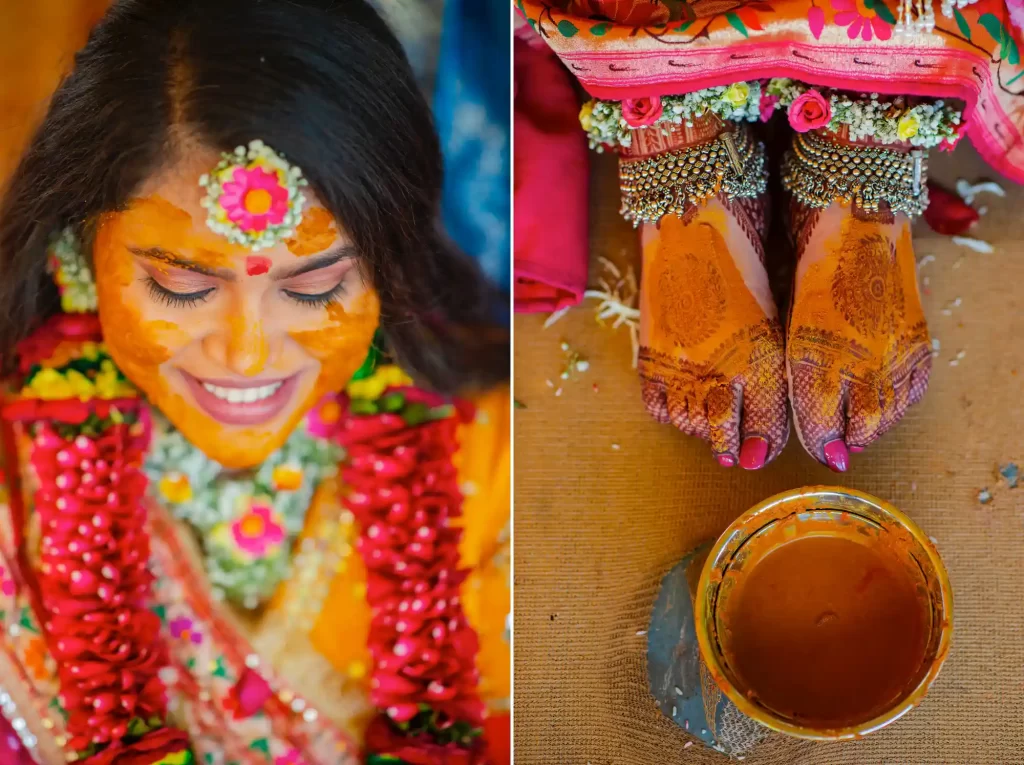 A bride smiling as her family and friends apply haldi paste on her face during the pithi ceremony