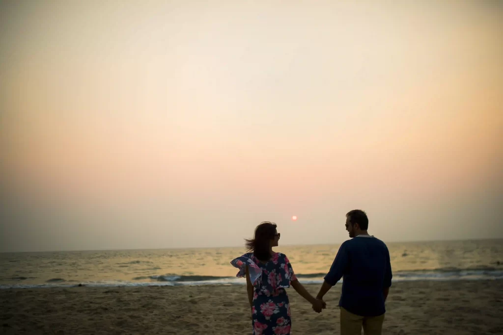 Romantic sunset backdrop for a joyful pre-wedding photo session in Goa.