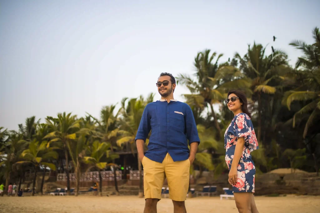 Couple surrounded by lush palm trees during their pre-wedding shoot in Goa.