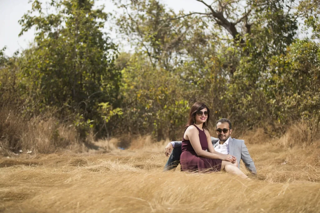 Captivating couple portrait with colorful Goan architecture in the background.
