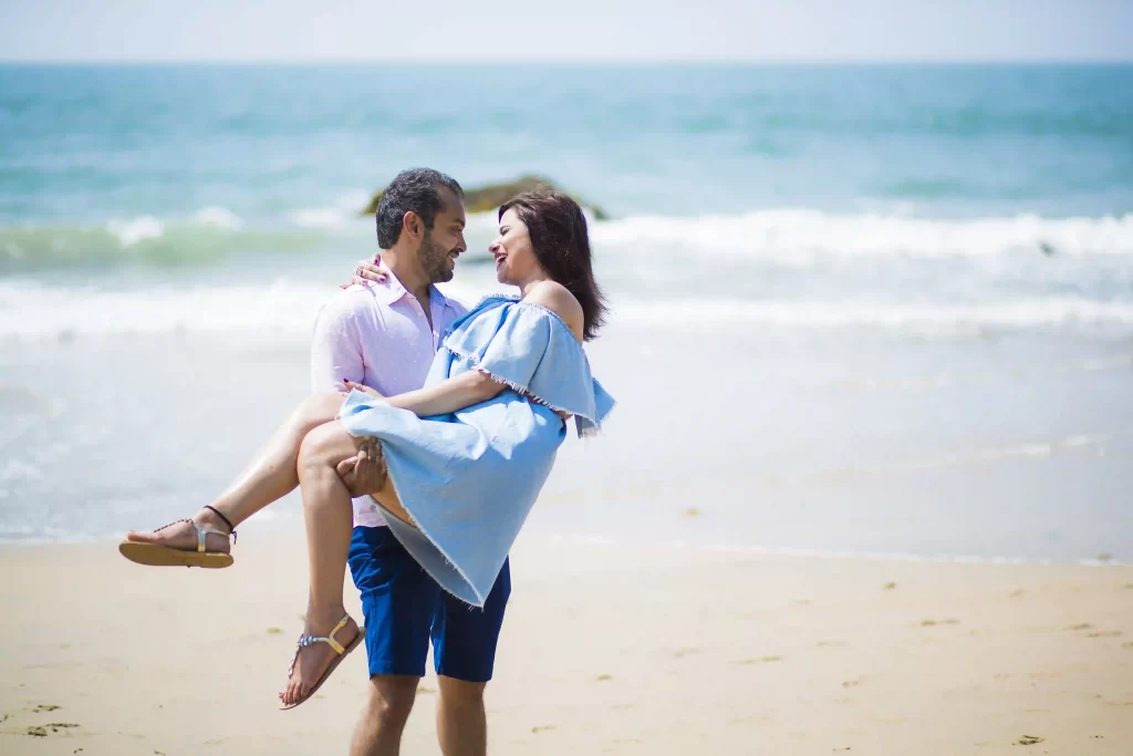Playful moments captured on the sandy shores of Goa during a pre-wedding shoot.