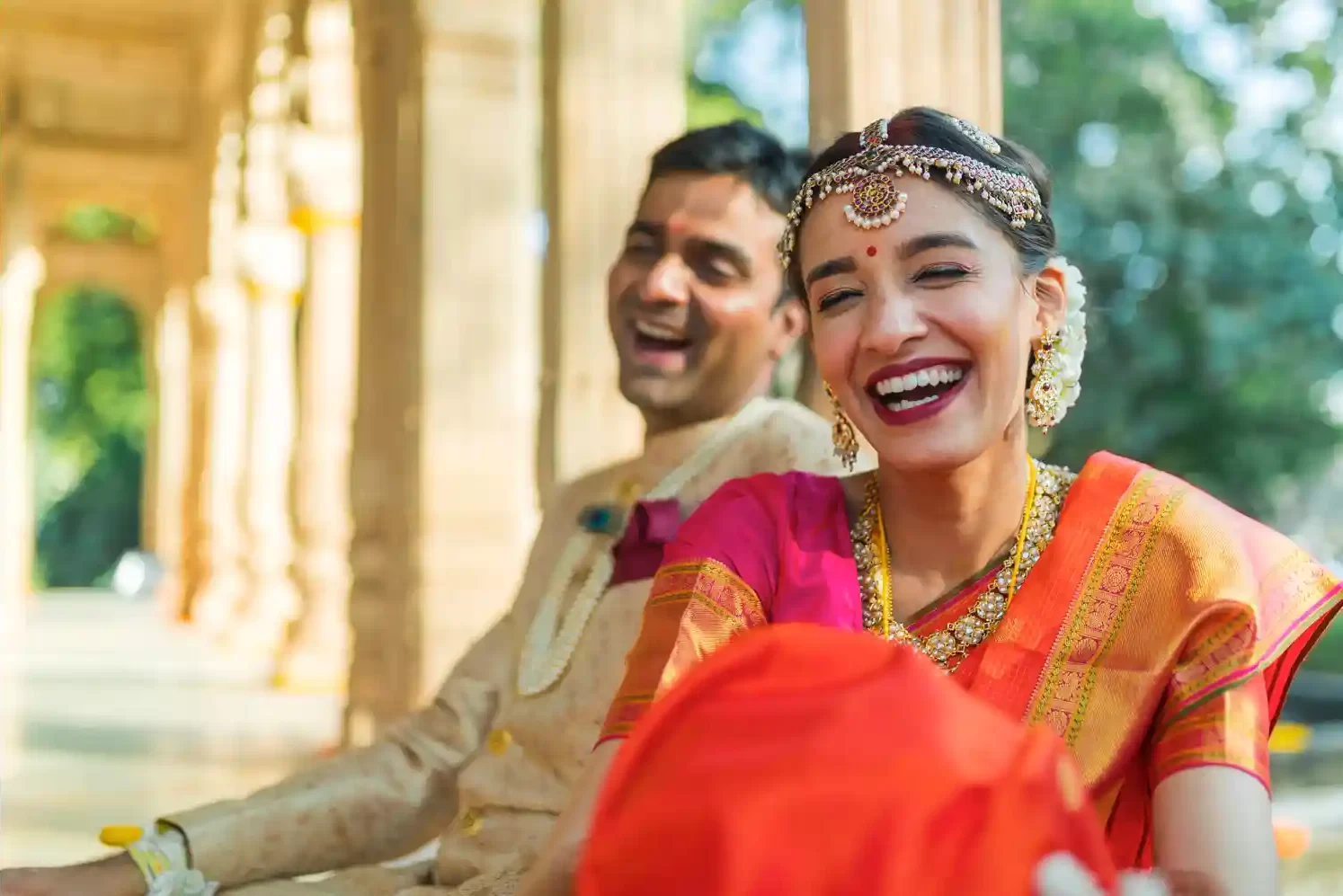 Romantic couple portrait at Neemrana, showcasing the love and joy of their destination wedding amidst stunning heritage architecture.