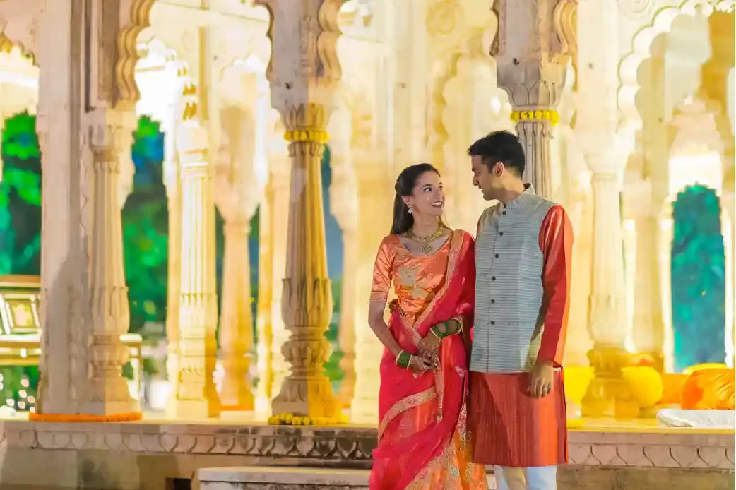 Romantic couple portrait at Neemrana, showcasing the love and joy of their destination wedding amidst stunning heritage architecture.