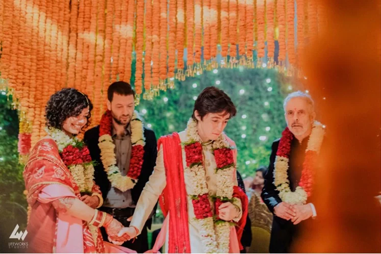 The couple takes pheras during their Hindu wedding in Dubai, walking around the sacred fire, signifying their eternal bond and commitment.