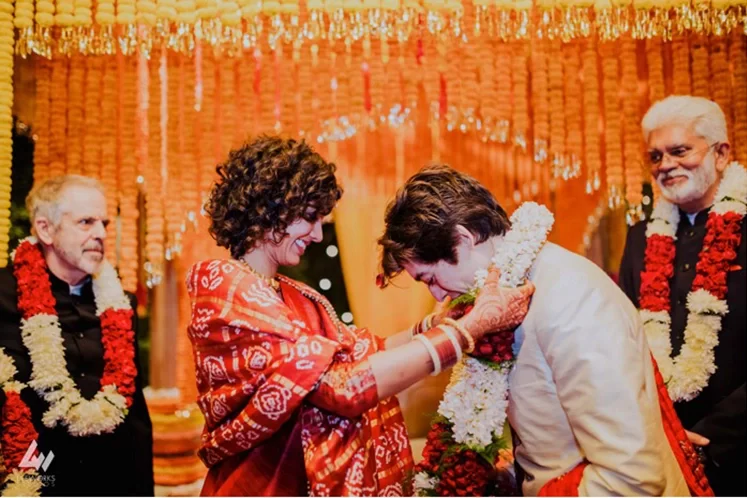The Hindu wedding in Dubai features the varmala ceremony, where the bride and groom exchange floral garlands amidst joyous celebrations.